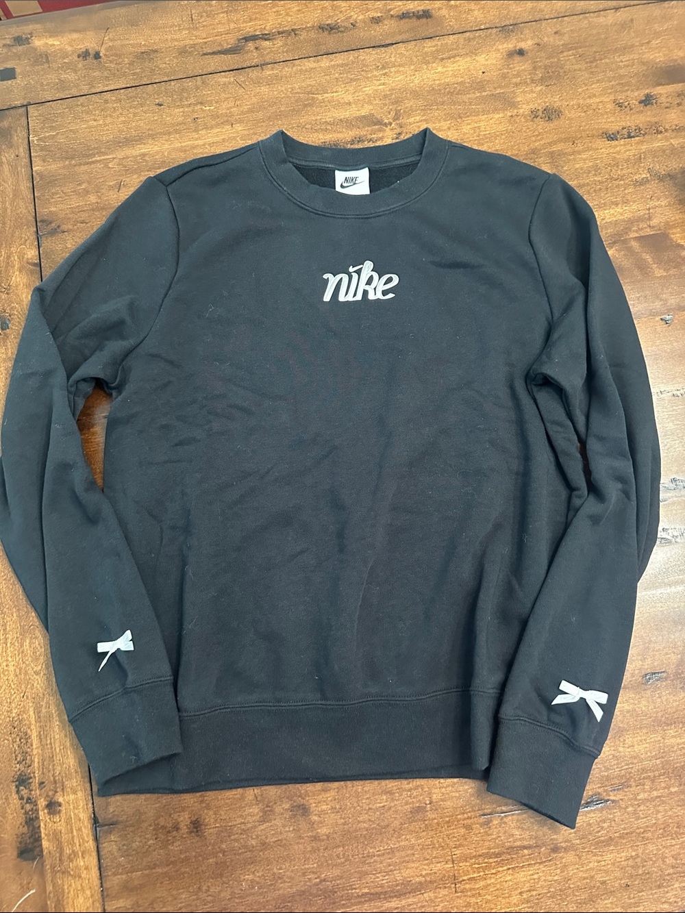 Nike Black Crewneck Sweatshirt with White Logo and Accent Bows